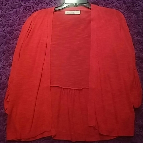 A light red loose swearter