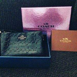 Black embossed coach wallet