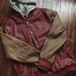 Faux leather varsity hooded jacket.