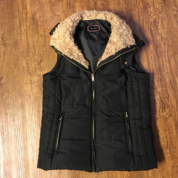 Black vest with fur collar and hood