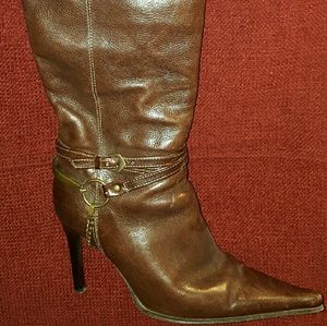 Knee high brown leather boot.