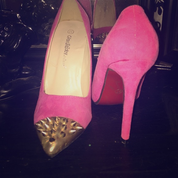 Pink pointed spike heels, red bottoms