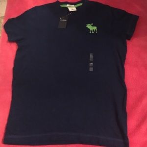 Blue t-shirt with green logo