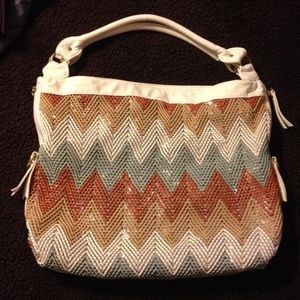 Huge multi-colored chevron designed purse.