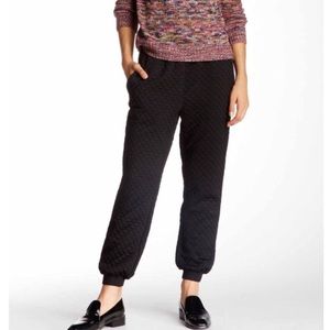 Lucca Couture black quilted pants.