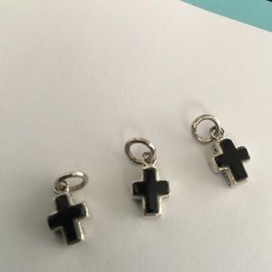 3 tiny black and silver crosses
