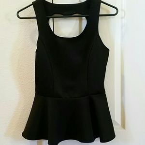 Black peplum top with a cut out heart shape & gems