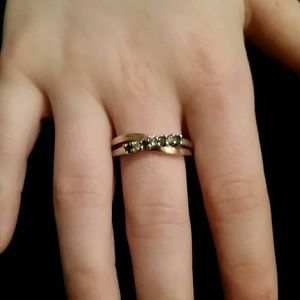 Gold ring with diamonds and emeralds