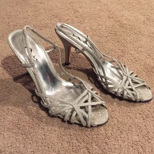 Kitten heel, silver sparkley shoes.