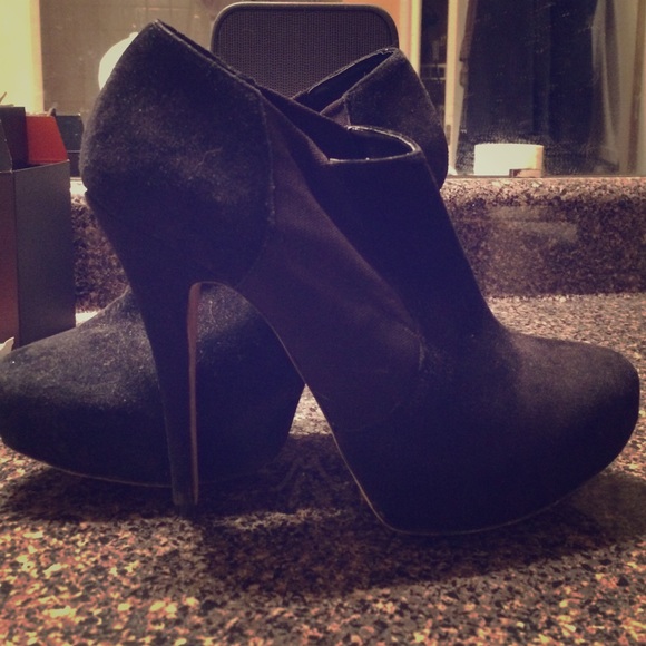 Black suede Vince Camuto booties.