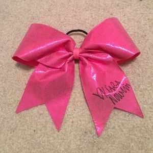 Pink cheer bow signed by kiara nowlin