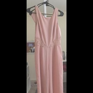 Pink jumpsuit with lace cutouts