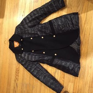 Black puff jacket with gold buttons.