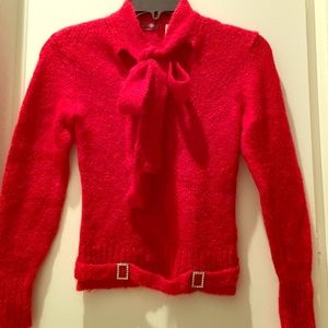 Mohair sweater with rhinestone details.