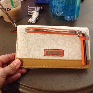 Calvin Klein wristlet cream/orange
