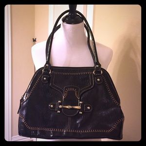 Black leather bag with brown stitching