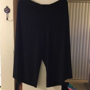 Black silky polyester below calf pants