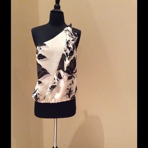 Bebe floral tan and black one shoulder shirt