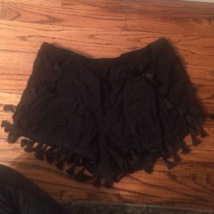 Black shorts with tassel embellishment