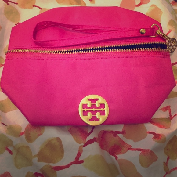 Small pink with gold emblem cosmetic travel bag