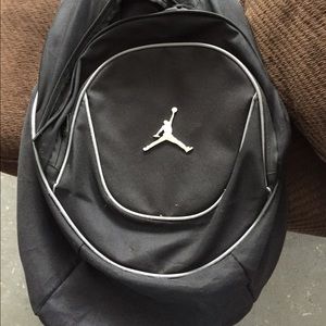 Black Jordan bookbag and pink pull over