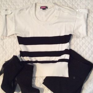 Black and white winged top
