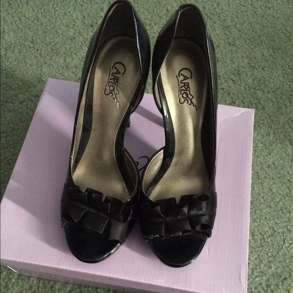 Carlos Santana black peep toe heels.