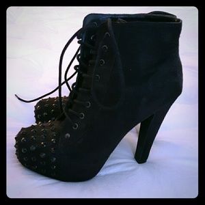 Black suede booties with studs on front of toe