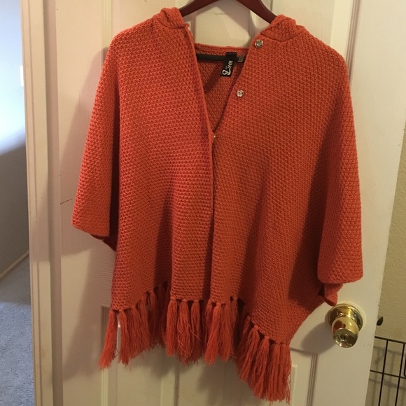 Cape with fringe and hood,worn three times.