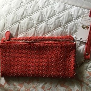 Leather NWT Adelade Woven fold over clutch.
