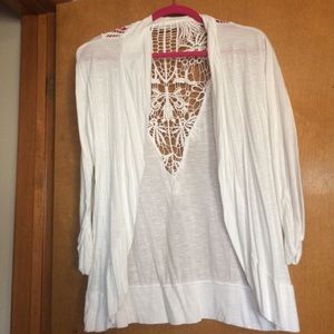 Gently worn white cardigan with design on back