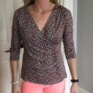 Cross front printed top