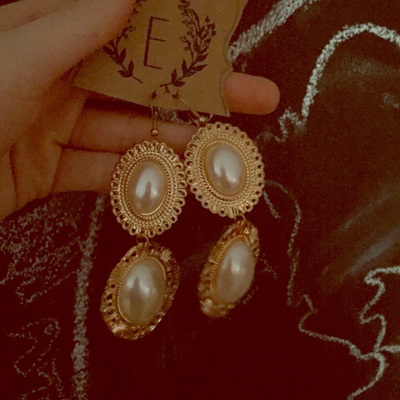 Gold and white dangle earrings