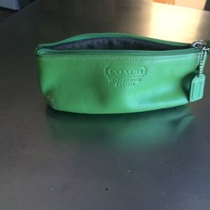 Coach green leather makeup bag.