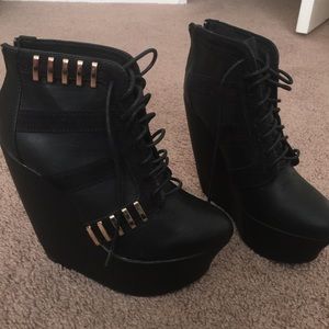 New black shorts boots , wedge heel