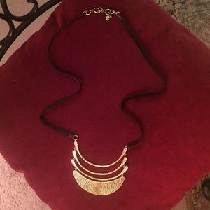 Leather & Gold necklace.
