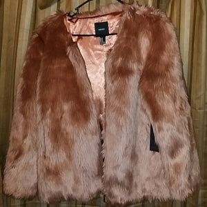 Fur coat the color of it is bronze