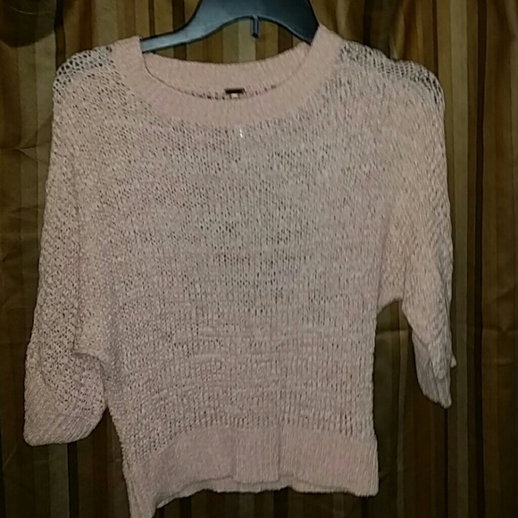 A peach sweater like