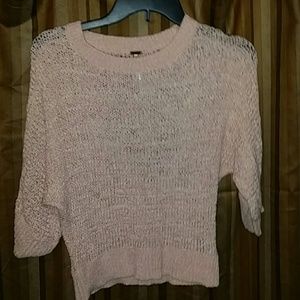 A peach sweater like