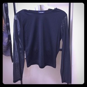 The limited black crop top with mesh sleeves