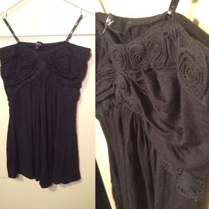 Strapless flowy top with rosette details