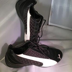 Black and white Puma running shoes