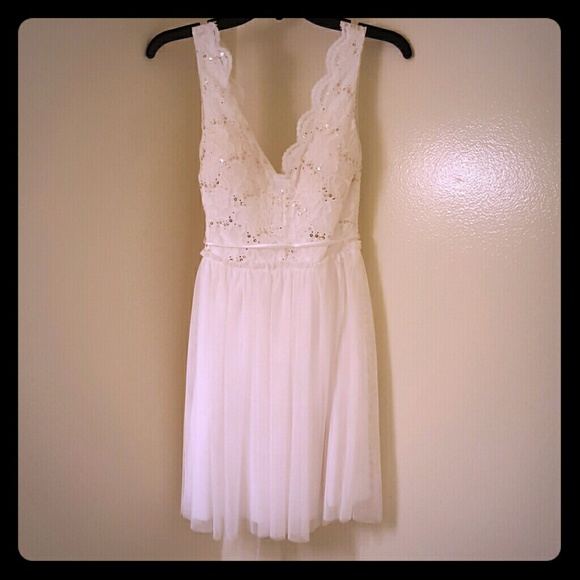 White lace dress with gold sequins