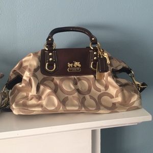 Classy and convertible gold and rose Coach bag!