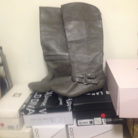 Below  the knees grey boots