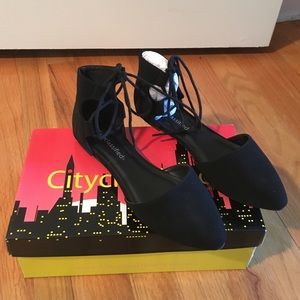 Black lace-up flats