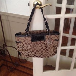 Medium authentic dark brown Coach purse