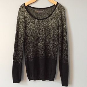 Black and gold sweater.