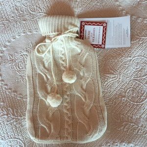 Hot water bottle with cover.
