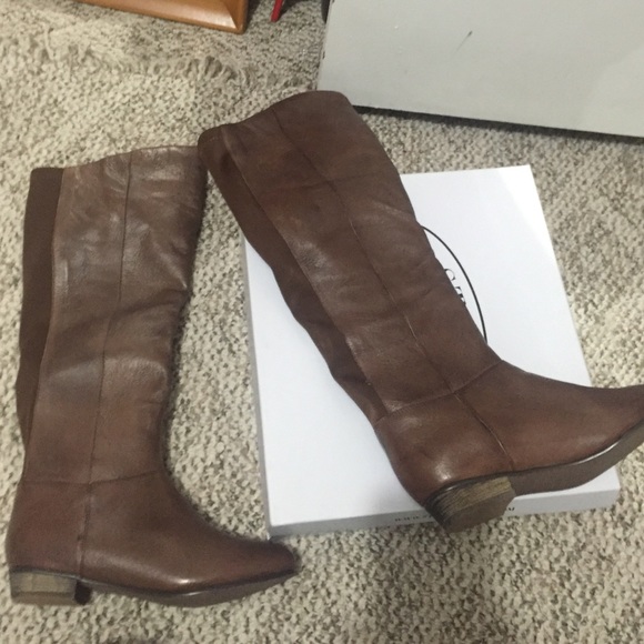 Brown boots. Never worn!! Have original box!